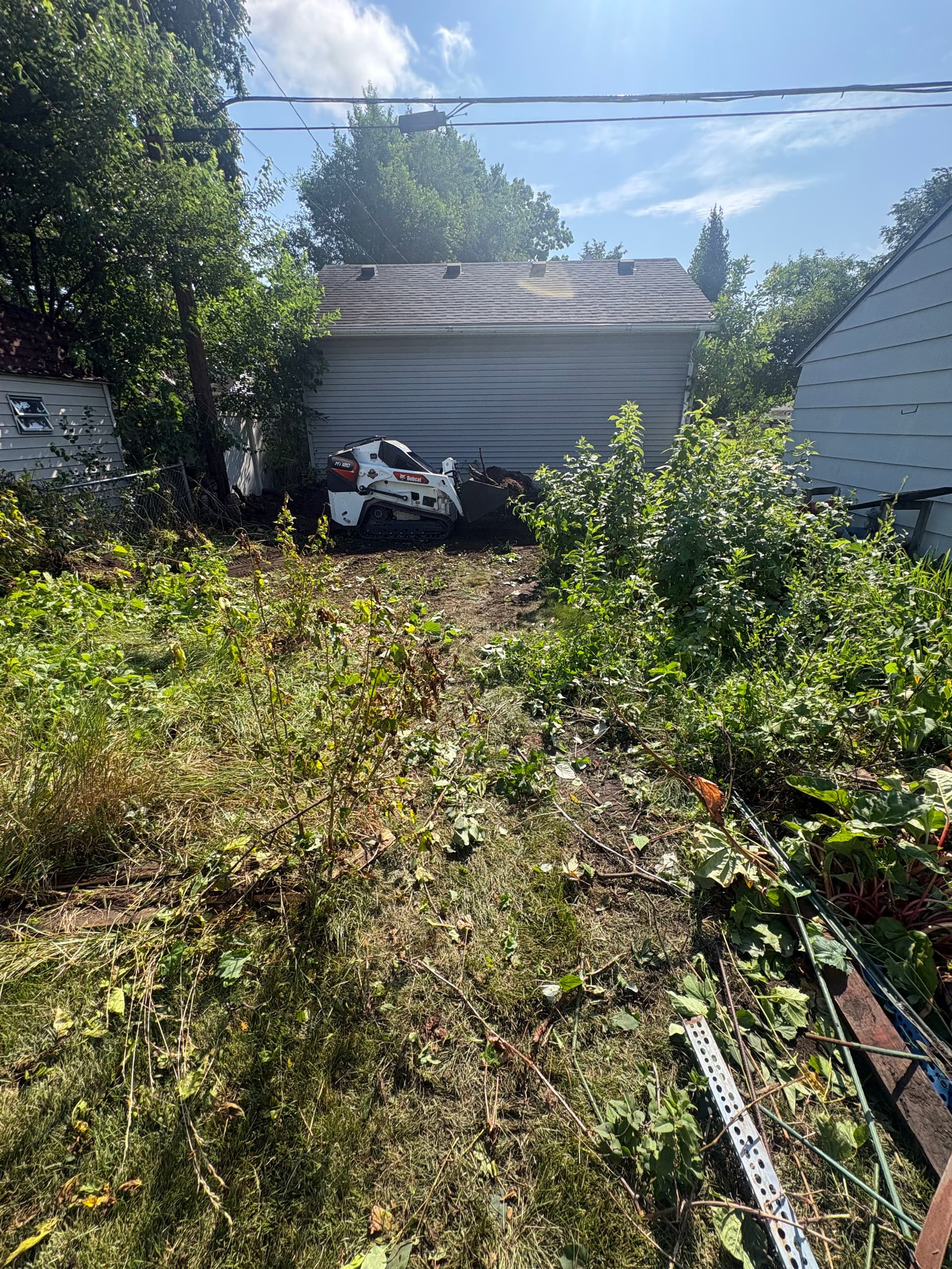 Land Clearing and Overgrowth Removal to Prep for a Retaining Wall image